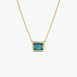 14K Gold 1.25 ctw Emerald Cut Bezel Setting Blue Topaz