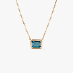 14K Gold 1.25 ctw Emerald Cut Bezel Setting Blue Topaz