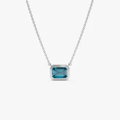 14K Gold 1.25 ctw Emerald Cut Bezel Setting Blue Topaz