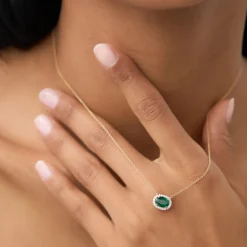 14k Oval Shape Emerald in Diamond Halo Setting